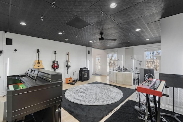 miscellaneous room featuring recessed lighting and wood finished floors