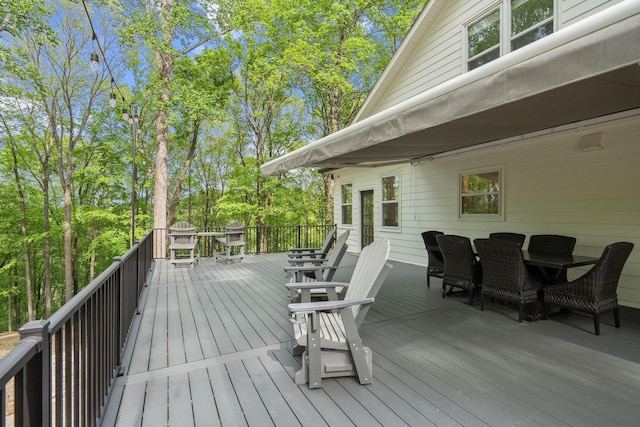 wooden deck with outdoor dining area