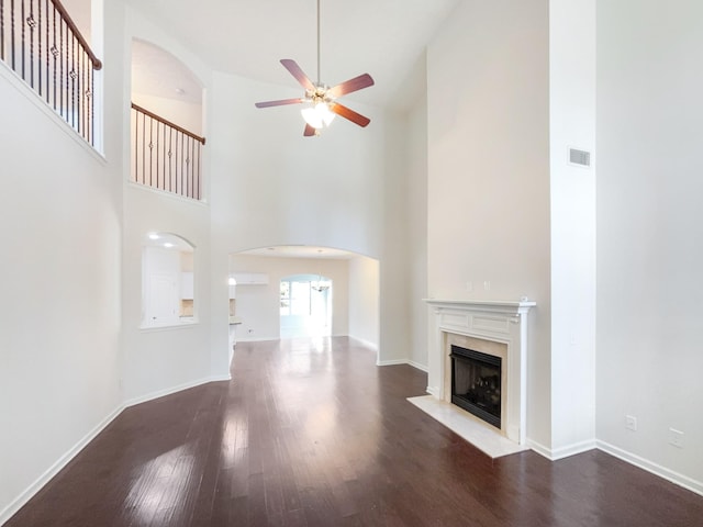1036 Middleton Ln, Gallatin, TN 37066 - unfurnished living room featuring a high end fireplace, visible vents, baseboards, wood finished floors, and a ceiling fan