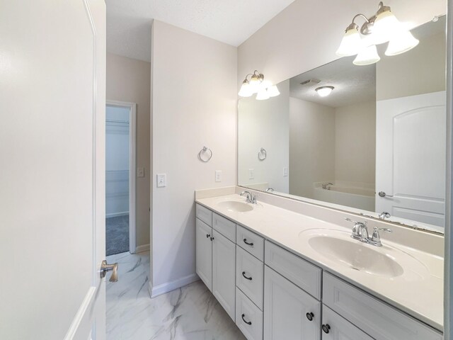 1036 Middleton Ln, Gallatin, TN 37066 - full bath with a sink, baseboards, marble finish floor, and double vanity