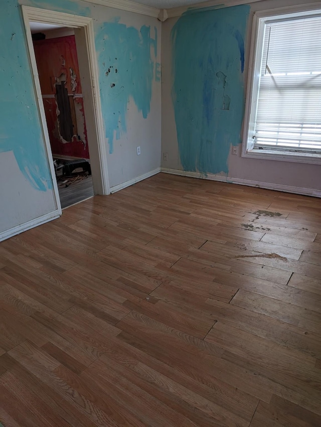 unfurnished room featuring wood finished floors