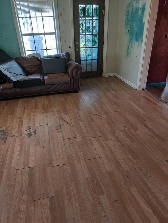 unfurnished living room featuring wood finished floors