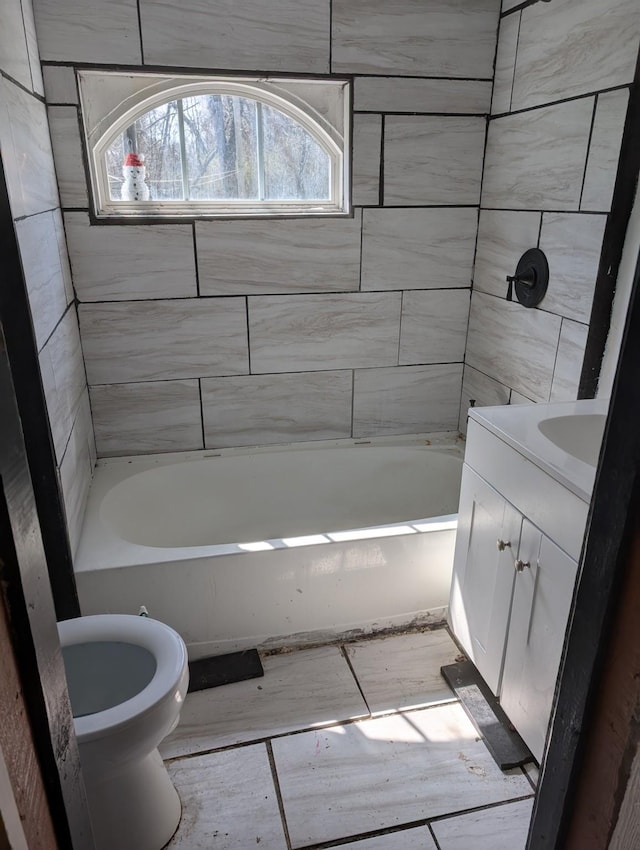 full bath with vanity, toilet, and shower / washtub combination