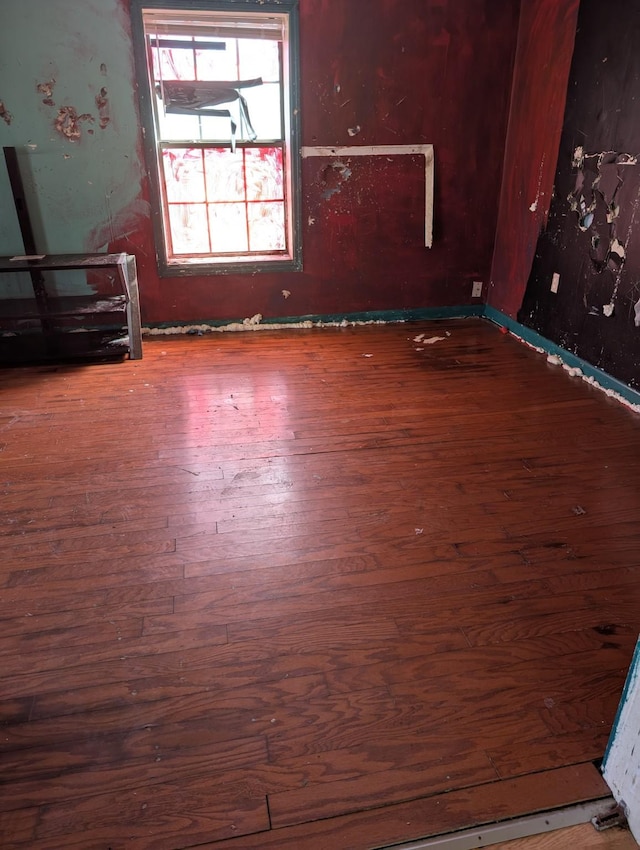 empty room with wood finished floors