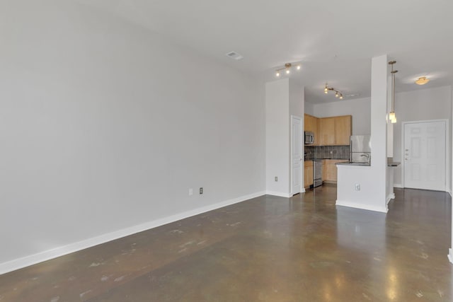 unfurnished living room featuring visible vents, baseboards, and finished concrete flooring