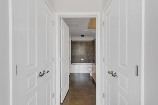 hall with concrete floors
