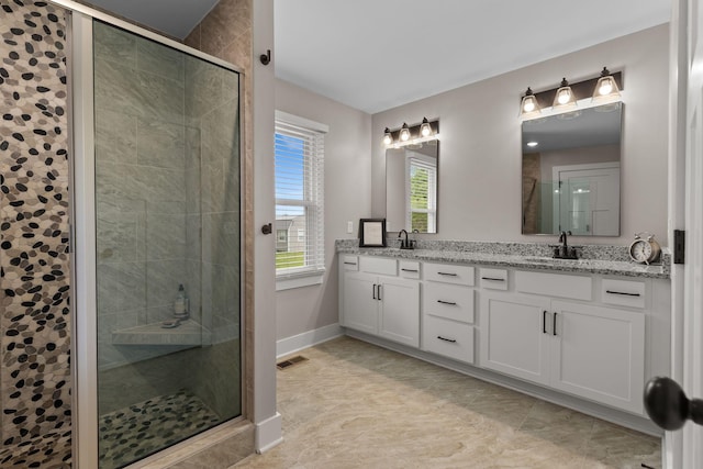 2436 J D Todd Rd, Murfreesboro, TN 37129 - bathroom featuring visible vents, a sink, a shower stall, and double vanity