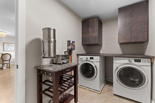 2436 J D Todd Rd, Murfreesboro, TN 37129 - clothes washing area featuring washer and dryer, cabinet space, a toaster, and light tile patterned floors
