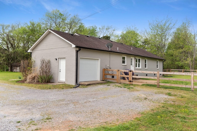 2436 J D Todd Rd, Murfreesboro, TN 37129 - rear view of house with brick siding, fence, driveway, and a garage