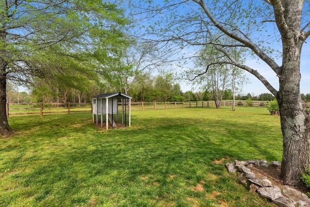 2436 J D Todd Rd, Murfreesboro, TN 37129 - view of yard featuring exterior structure, an outdoor structure, fence, and a rural view