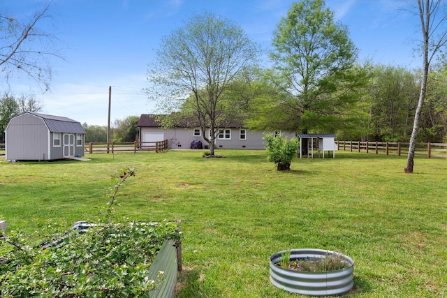 2436 J D Todd Rd, Murfreesboro, TN 37129 - view of yard with fence, an outbuilding, and a storage shed