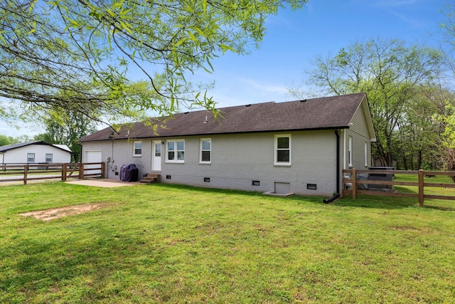 2436 J D Todd Rd, Murfreesboro, TN 37129 - back of house featuring a shingled roof, a fenced backyard, a yard, a patio area, and crawl space