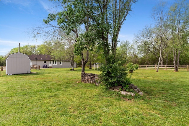 2436 J D Todd Rd, Murfreesboro, TN 37129 - view of yard featuring a storage unit, an outbuilding, and fence