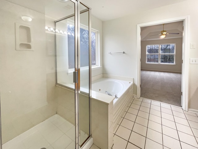 full bath featuring tile patterned floors, a bath, a ceiling fan, and a stall shower