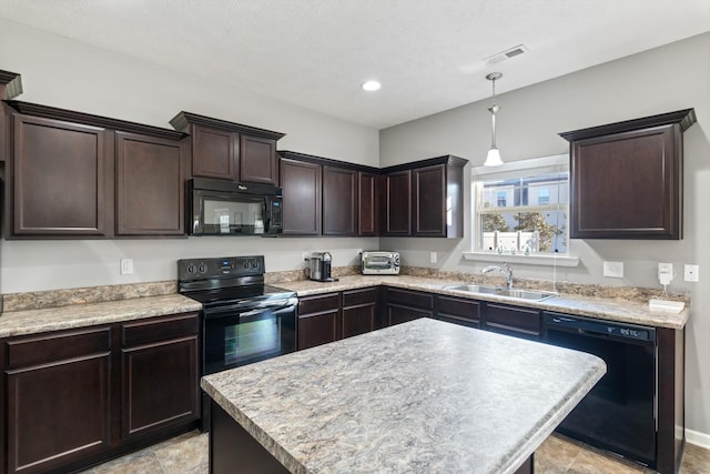 kitchen featuring visible vents, a sink, black appliances, light countertops, and dark brown cabinets