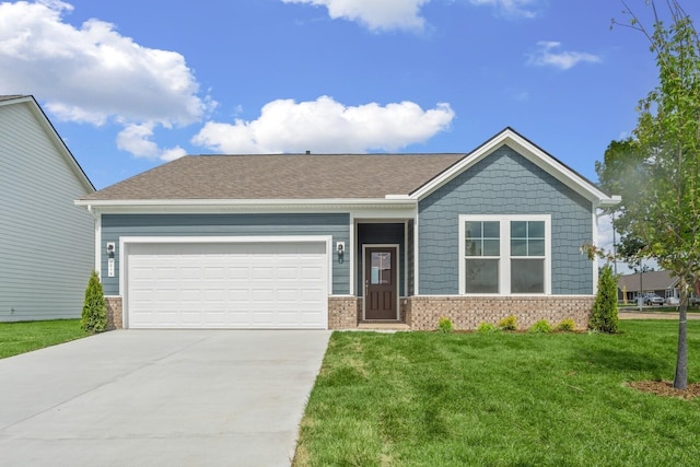 view of front of house with driveway, roof with shingles, an attached garage, a front lawn, and brick siding