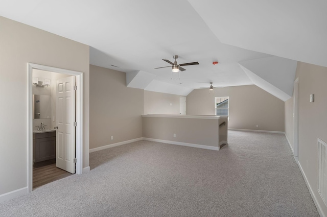 871 Blessings Way, Gallatin, TN 37066 - bonus room with baseboards, light carpet, lofted ceiling, and a ceiling fan