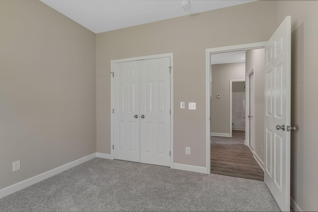 871 Blessings Way, Gallatin, TN 37066 - unfurnished bedroom with a closet, baseboards, and carpet