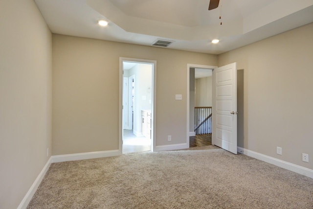 unfurnished bedroom with carpet flooring, recessed lighting, baseboards, and visible vents