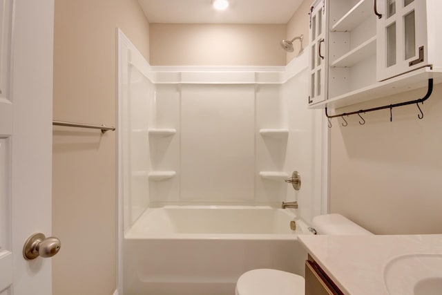 bathroom with toilet, shower / washtub combination, and vanity