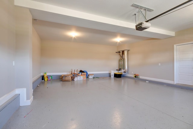 garage featuring a garage door opener and baseboards