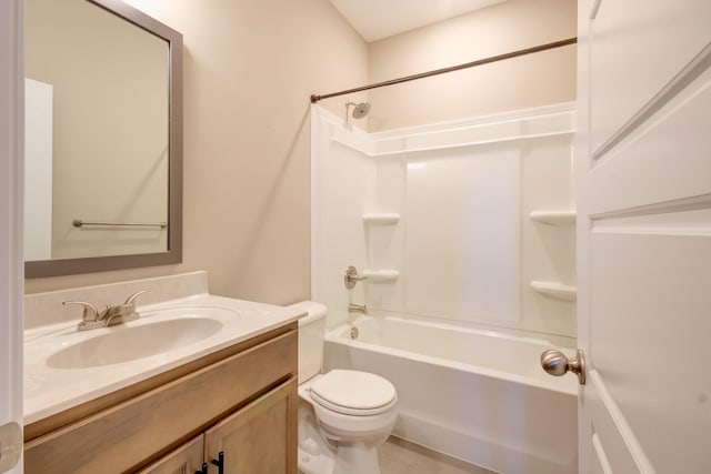 bathroom with tub / shower combination, toilet, and vanity