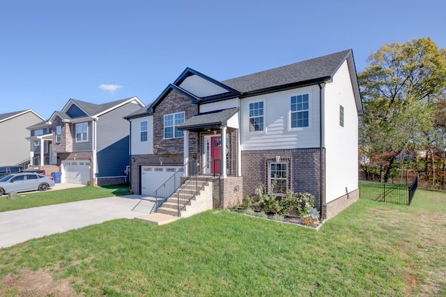 split foyer home with brick siding, concrete driveway, a front lawn, and fence