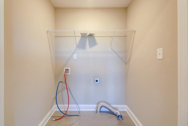 laundry area featuring washer hookup, laundry area, baseboards, and electric dryer hookup