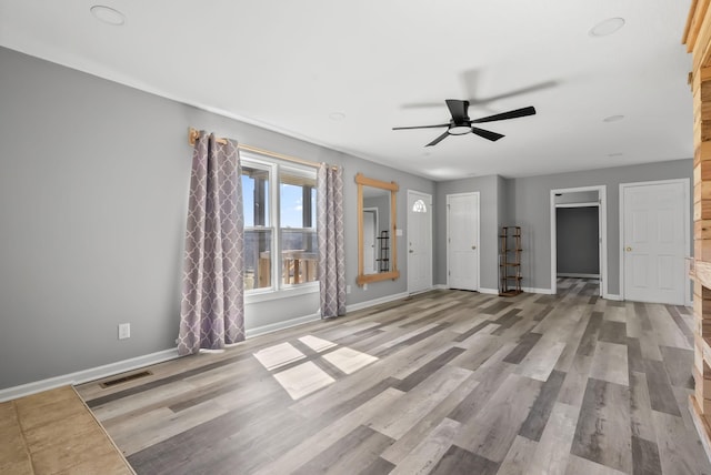 928 Red Bird Ln, Cumberland Furnace, TN 37051 - unfurnished living room with light wood-style flooring, baseboards, and visible vents
