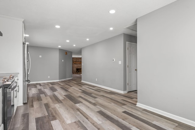 928 Red Bird Ln, Cumberland Furnace, TN 37051 - unfurnished living room featuring recessed lighting, baseboards, and light wood-style floors