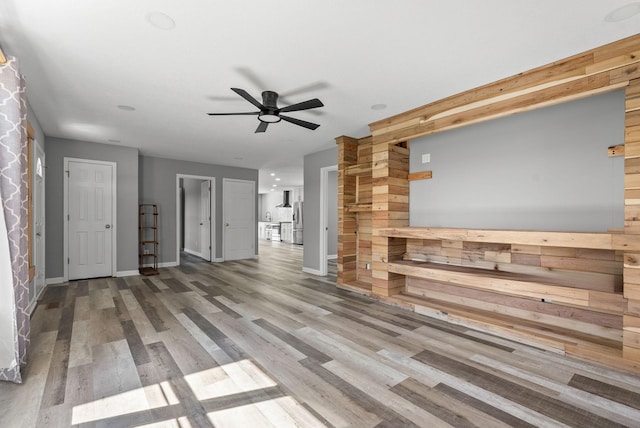 928 Red Bird Ln, Cumberland Furnace, TN 37051 - unfurnished living room with baseboards, ceiling fan, and wood finished floors