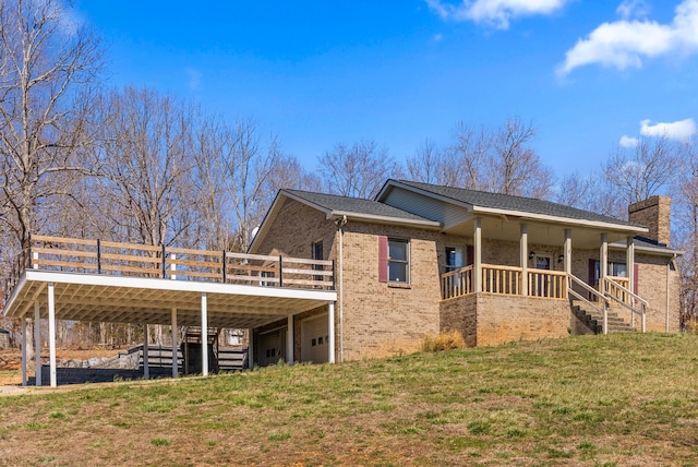 928 Red Bird Ln, Cumberland Furnace, TN 37051 - view of side of home featuring stairway, a yard, brick siding, and a chimney