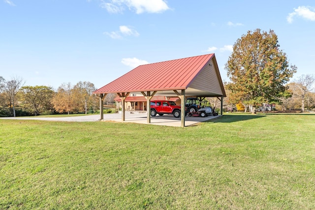 surrounding community featuring a carport and a lawn