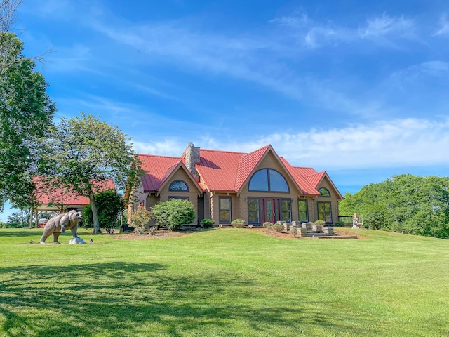 1668 Link Rd, New Johnsonville, TN 37134 - back of property featuring metal roof, a lawn, a chimney, and a standing seam roof