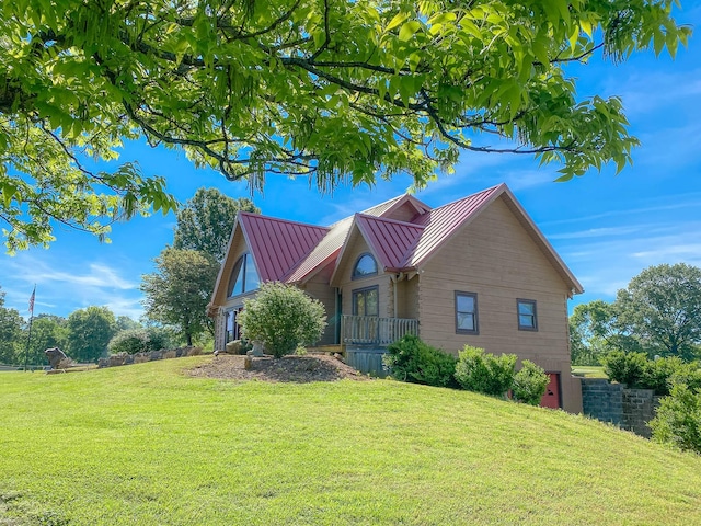 1668 Link Rd, New Johnsonville, TN 37134 - view of front of home with a standing seam roof, a front lawn, and metal roof