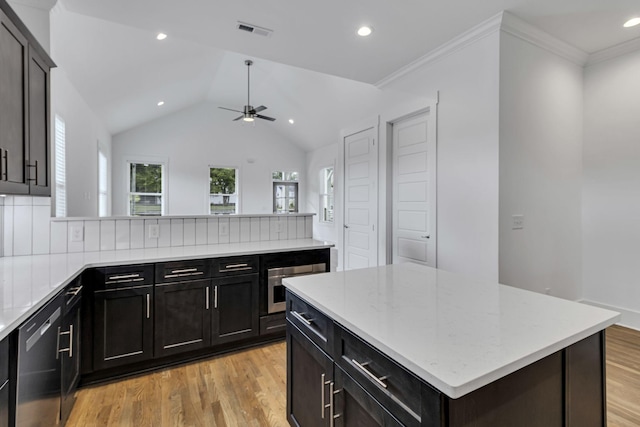 kitchen featuring visible vents, plenty of natural light, light wood-style floors, and dishwasher