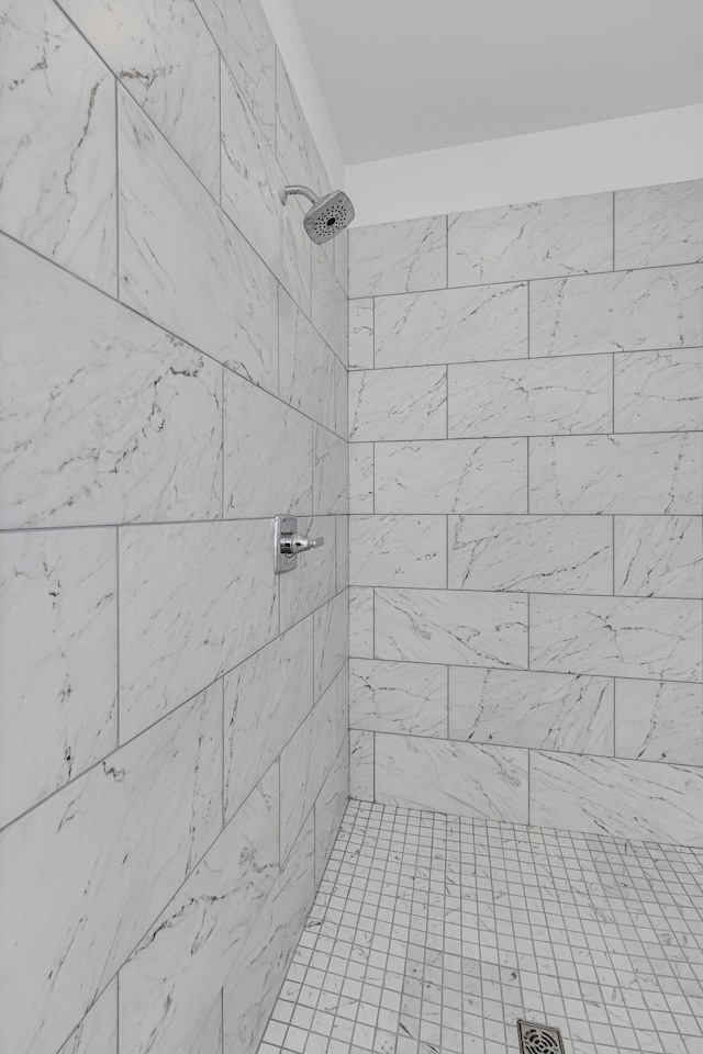 bathroom with tiled shower