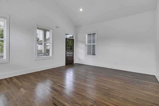 spare room with recessed lighting, baseboards, high vaulted ceiling, and dark wood finished floors