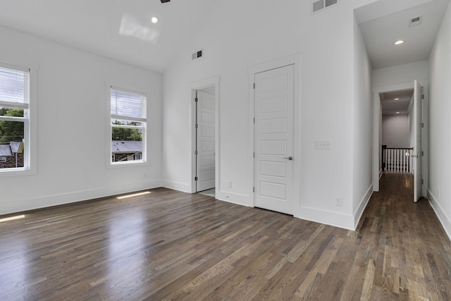 unfurnished bedroom featuring visible vents, recessed lighting, baseboards, and wood finished floors