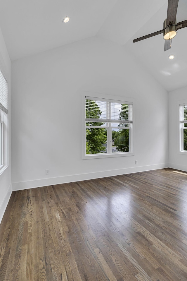 unfurnished room featuring recessed lighting, wood finished floors, baseboards, and vaulted ceiling