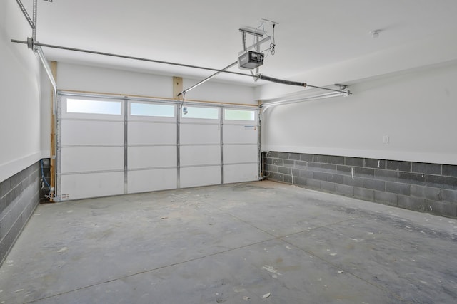 904 32nd Ave N Unit A, Nashville, TN 37209 - garage with a garage door opener and concrete block wall