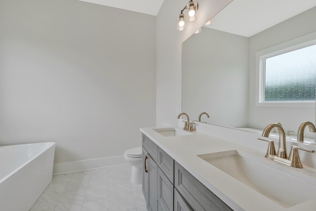 904 32nd Ave N Unit A, Nashville, TN 37209 - bathroom with a freestanding tub, double vanity, and marble look tiles
