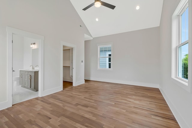 904 32nd Ave N Unit A, Nashville, TN 37209 - unfurnished bedroom with light wood finished floors, a spacious closet, ensuite bathroom, high vaulted ceiling, and ceiling fan