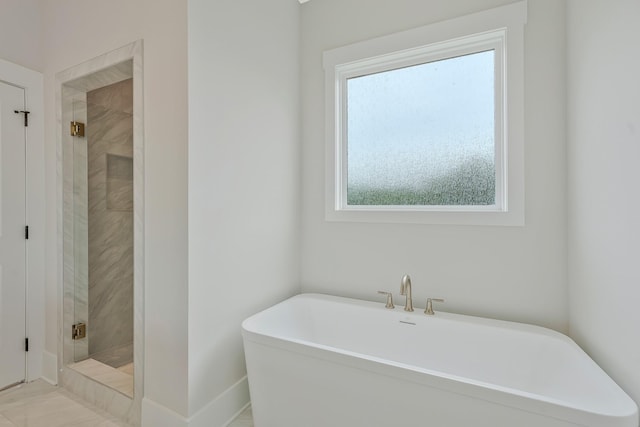 904 32nd Ave N Unit A, Nashville, TN 37209 - full bathroom featuring a freestanding tub and a shower stall