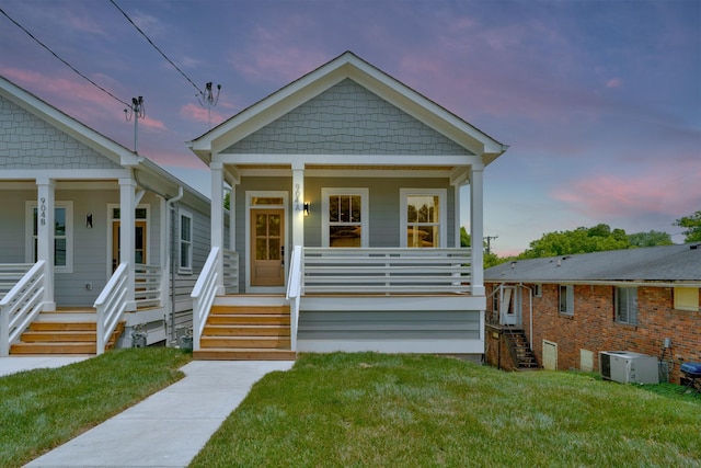 904 32nd Ave N Unit A, Nashville, TN 37209 - view of front of house featuring covered porch, stairway, and a lawn