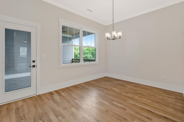 904 32nd Ave N Unit A, Nashville, TN 37209 - spare room featuring crown molding, a chandelier, and light wood-style floors
