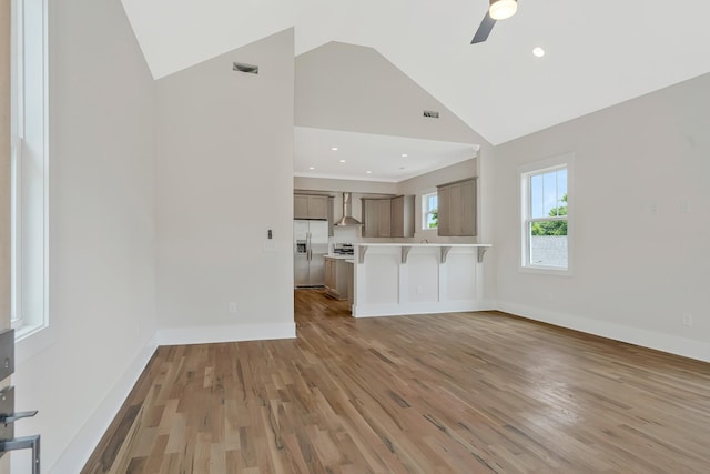904 32nd Ave N Unit A, Nashville, TN 37209 - unfurnished living room with a ceiling fan, light wood finished floors, high vaulted ceiling, and recessed lighting