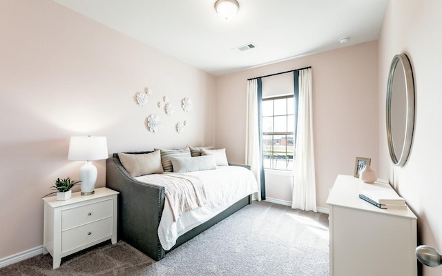 bedroom with carpet, visible vents, and baseboards