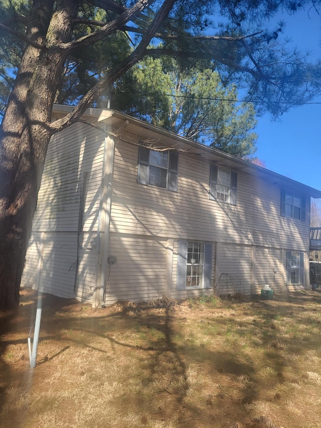 view of home's exterior featuring a yard