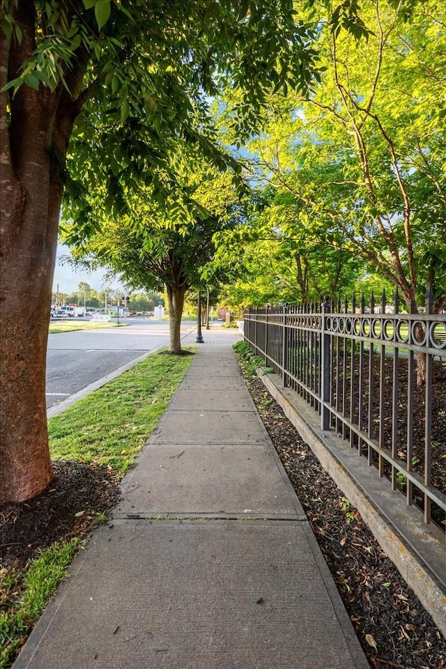 view of property's community with fence